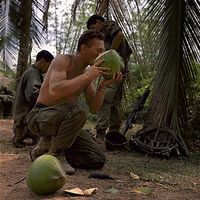 American-Soldier-Drinking-Coconut,-Binh-Dinh,-Vietnam,-1968